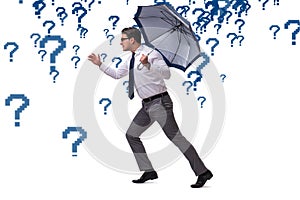 The uncertainty concept with businessman and question marks