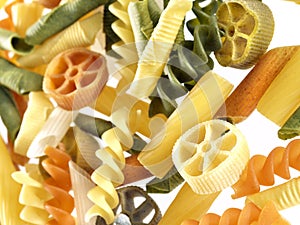 Unckoked pasta on white background photo