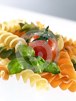 Unckoked pasta on white background photo