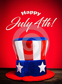 Uncle Sam hat on red background with Happy July 4th greeting
