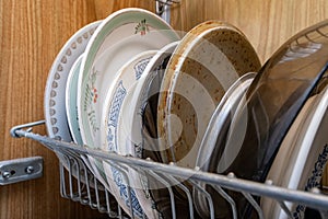 An unclean crockery, kitchen utensils, dishware of an elderle senior retired person with senile dementia