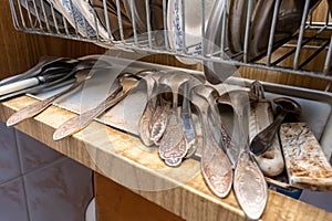 An unclean dirty crockery, kitchen utensils, dishware and tableware of an elderle senior retired person with senile dementia