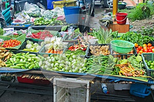 Unclean vegetable sale food rural street market in Asia. photo