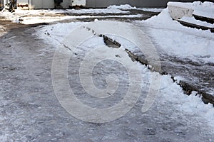 Uncleaned from snow, icy sidewalk