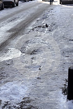Uncleaned from snow, icy sidewalk