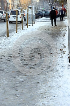 Uncleaned from snow, icy sidewalk