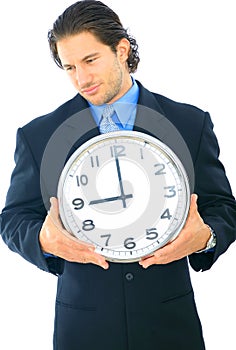 Uncomfortable Businessman Holding Clock
