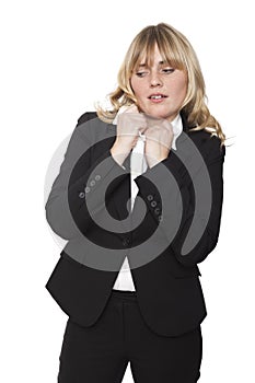 Uncomfortable woman tugging at her collar photo