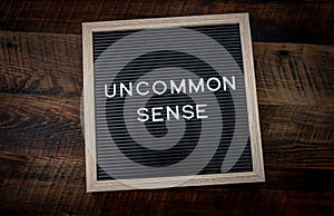 Uncommon Sense Sign