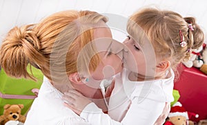 Unconditional love - a Kiss - mother and daughter