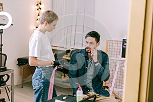 Unconfident bearded man deciding on part of body for tattoo photo