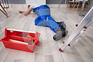 Unconscious Handyman Lying On Floor