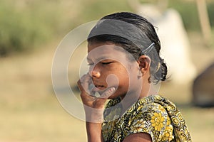 Unconscious India girl is cleaning nose.