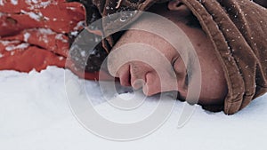 Unconscious man lies on the snow