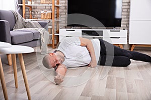 Unconscious Man Lying On Floor photo