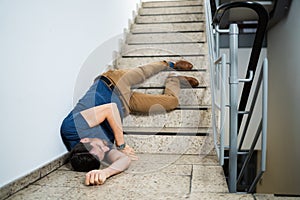 Unconscious Man Lying On Staircase