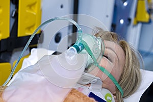 Unconscious Woman With Oxygen Mask photo