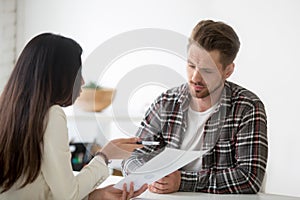 Unconvinced skeptical client looking doubtful about deal listeni