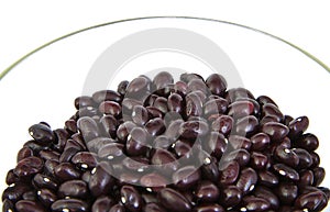 Uncoocked red beans on a cristal bowl. Gernika