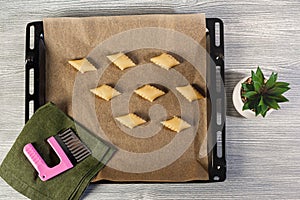 Uncooked azerbaijani cookies in a baking tray