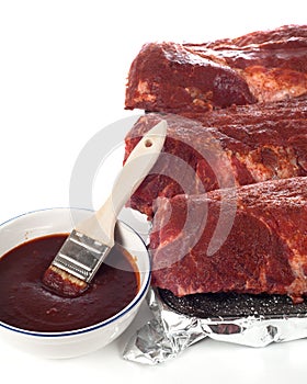 Uncooked Baby Back Ribs With BBQ Sauce photo
