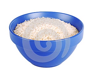 Uncooked basmati rice in a ceramic blue bowl