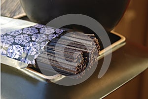 Uncooked black rice soba noodles on a plate photo