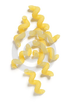 Uncooked Cavatappi or Corkscrew Pasta on White Background