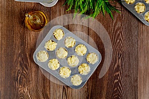 Uncooked cheese bread called chipa in baking tray