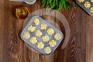 Uncooked cheese bread called chipa in baking tray photo