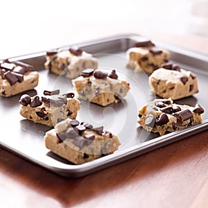 Uncooked cookie dough on a baking pan photo