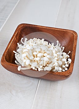 Uncooked enoki mushrooms vertical