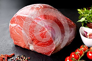 Uncooked fresh pork and beef. Piece of raw red meat with black background photo