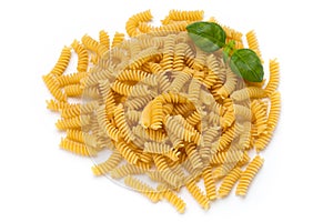 Uncooked fusilli pasta isolated white background.