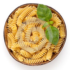 Uncooked fusilli pasta isolated white background.