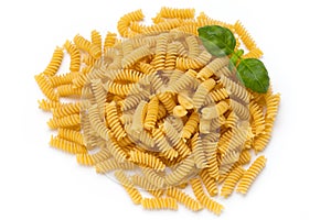 Uncooked fusilli pasta isolated white background.