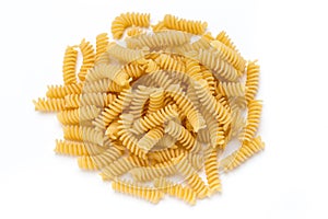 Uncooked fusilli pasta isolated white background.