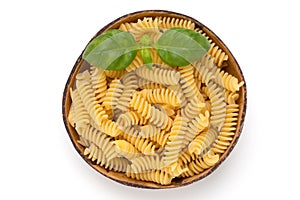 Uncooked fusilli pasta isolated white background.