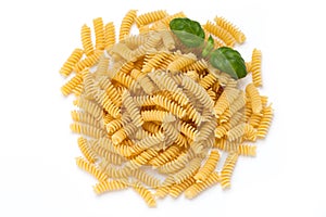 Uncooked fusilli pasta isolated white background.