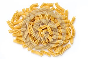 Uncooked fusilli pasta isolated white background.