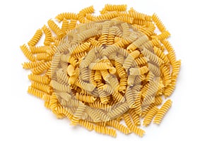 Uncooked fusilli pasta isolated white background.