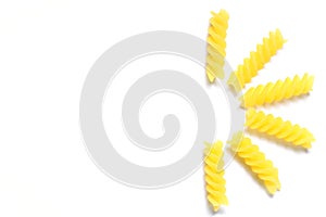 Uncooked fusilli pasta isolated on white background. Itallian spiral pasta close-up on white background