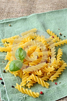Uncooked gluten free fusilli pasta from blend of corn and rice flour