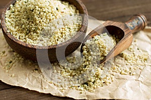 Uncooked Hemp seeds in a bowl with a spoon