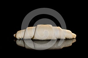 Uncooked homemade croissant on tray in electric oven: close up, black background