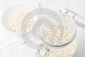 Uncooked instant oatmeal in glass jar, shorth depth of field