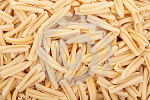 Uncooked Italian Casarecce pasta made from organic durum wheat semolina. Macaroni.