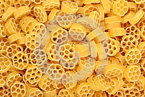 Uncooked italian pasta rotelle as background