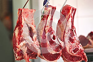 Uncooked meat hanging on photo