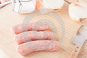 Uncooked meat sausages